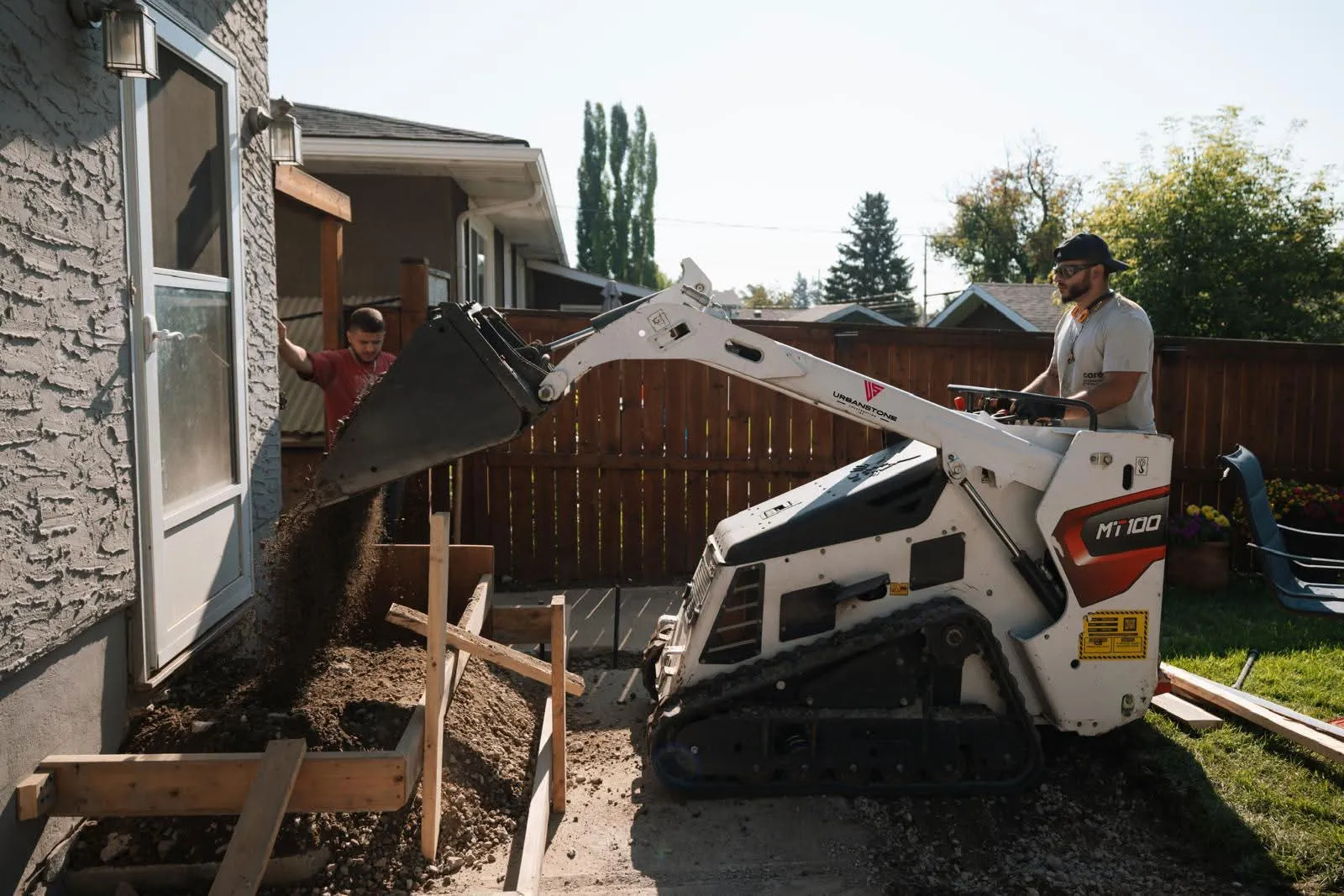 Concrete line pumping and pouring services by Urban Stone Construction in Calgary